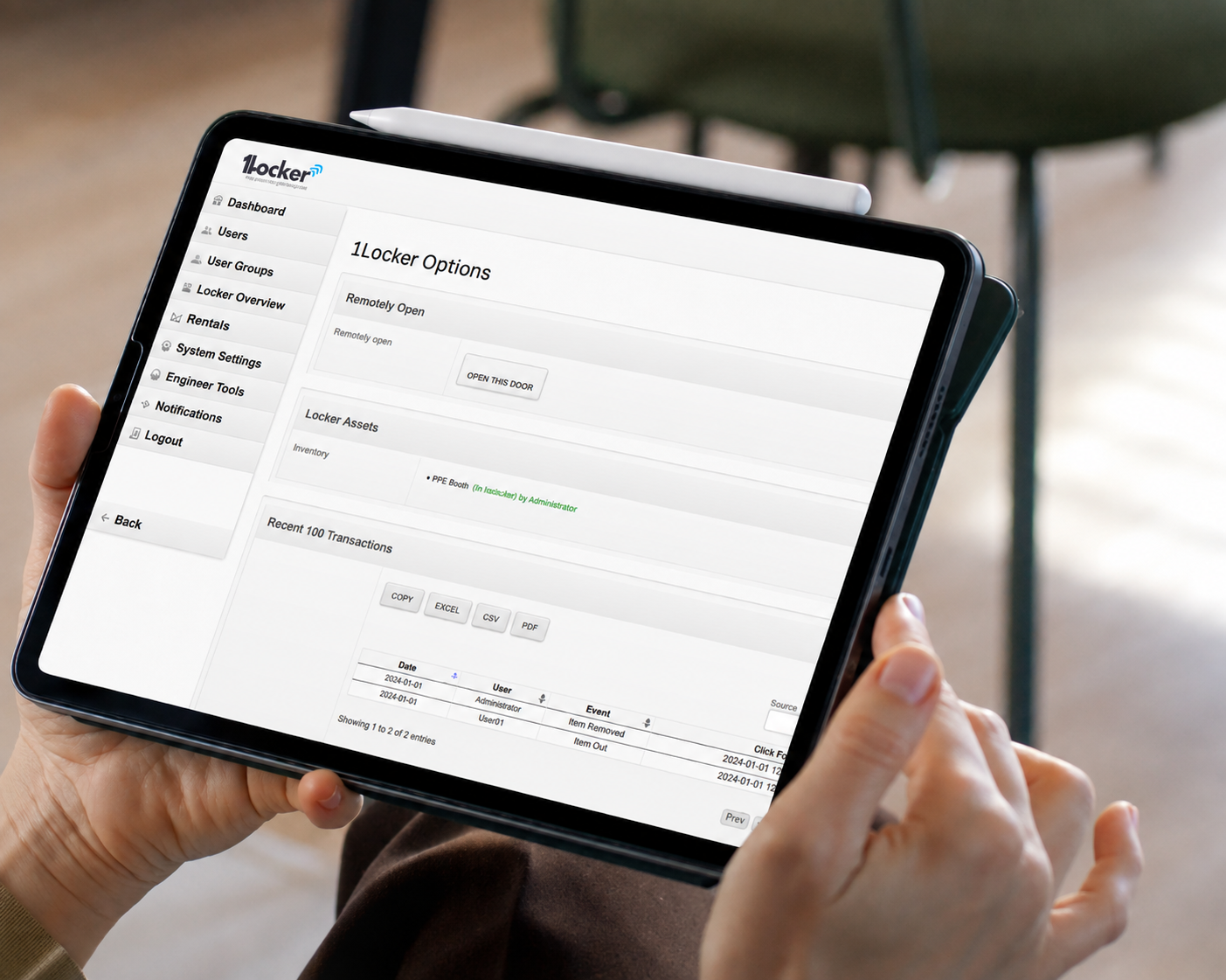 A person holding a tablet displaying the 1Locker mobile application interface, with a white stylus resting on top of the device.